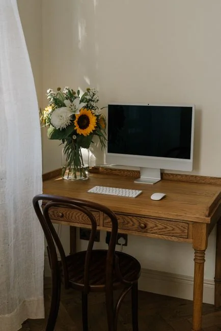 creative-01 A clean and organized home office desk with a cleaner bottle and sponge, emphasizing simplicity and functionality.